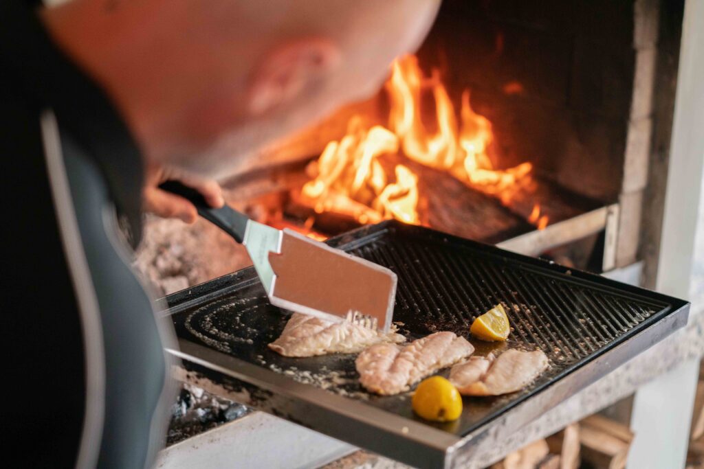 Cooking on a swing frame